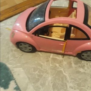 Barbies barbie car and boat and doll clothes